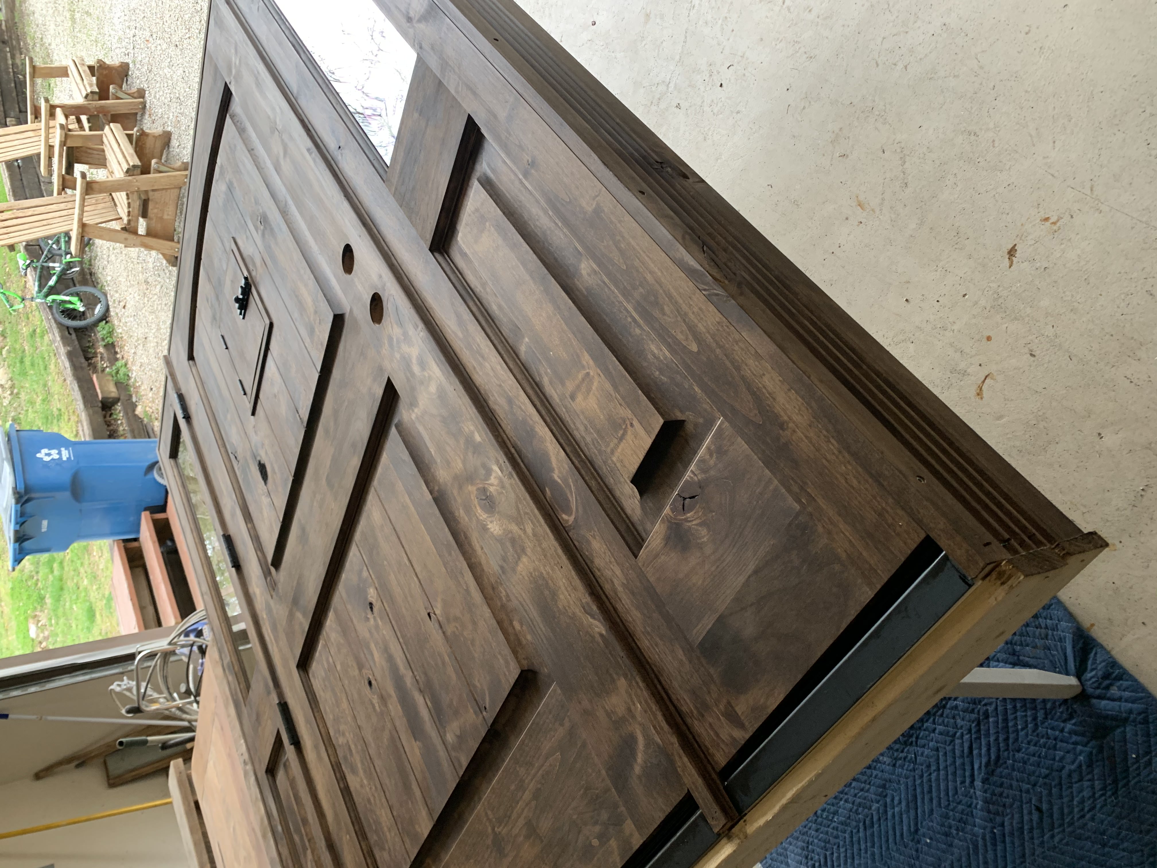 Close-up of a stained wood door finished by our crew